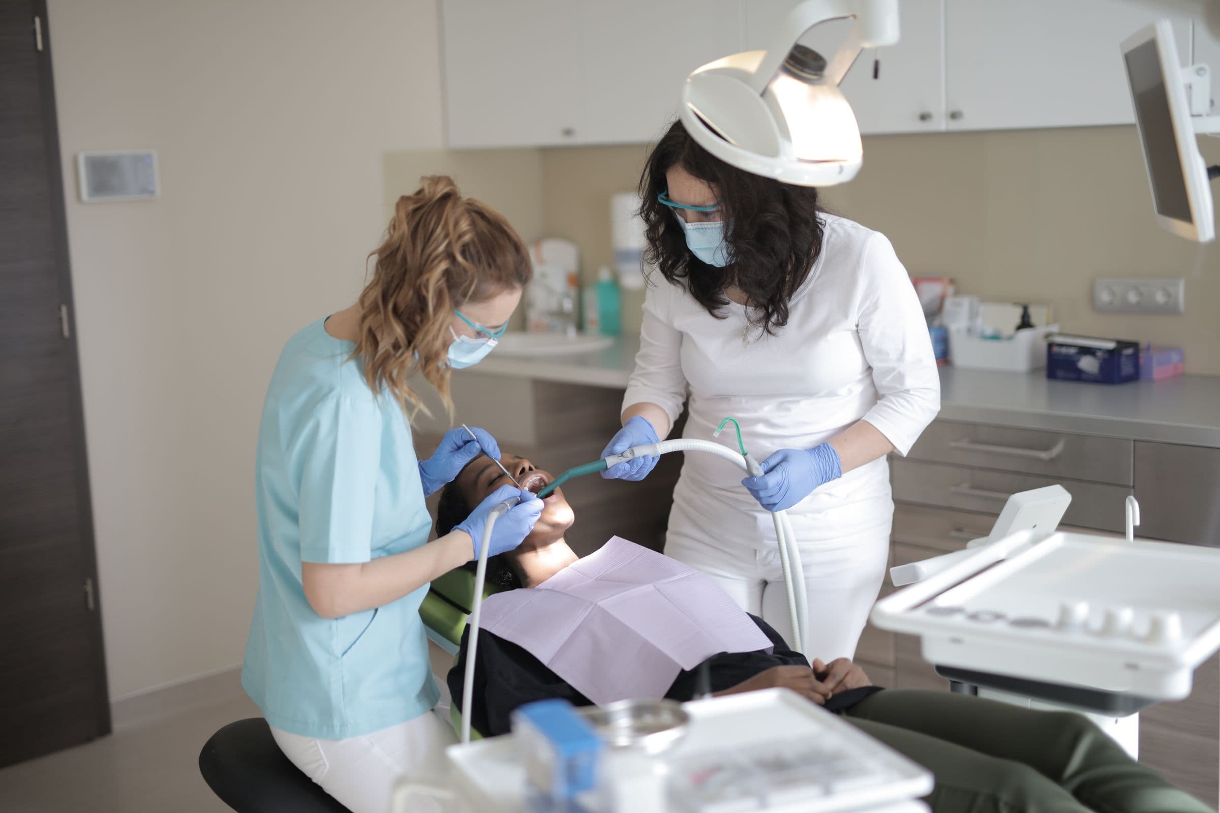 Dentex dentists treating a patient in the clinic